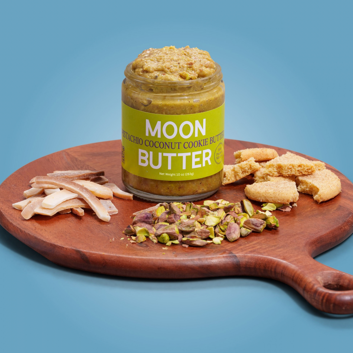 Pistachio Coconut Cookie Butter Moon Butter jar on toast with banana and pistachio